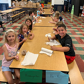 kindergarten and Pre-k students at a table